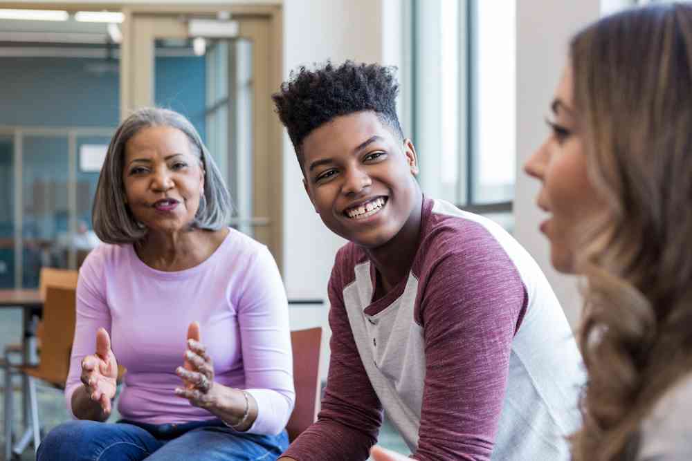 479cc74eca9f30693f51e50825610c40-teen-boy-in-group-mom-in-back_l